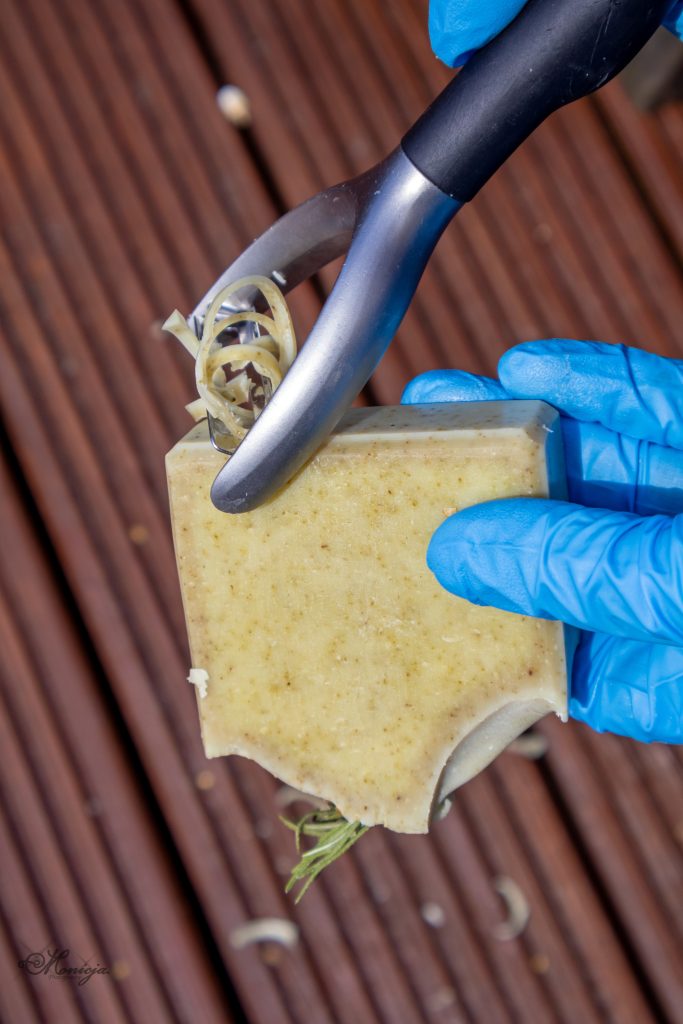 Justyna shaping handmade soap with her hands during the soap making process in Midlothian